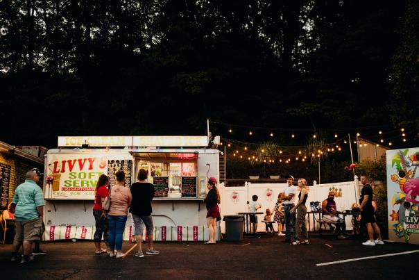 People line up in the evening in front of Livvy's Ice Cream Stand.