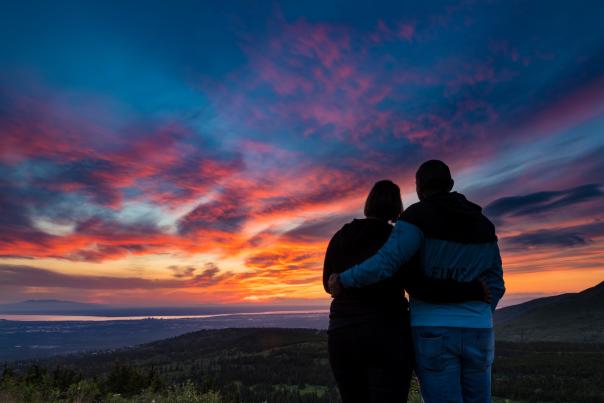 A couple admires the sunset in Anchorage.