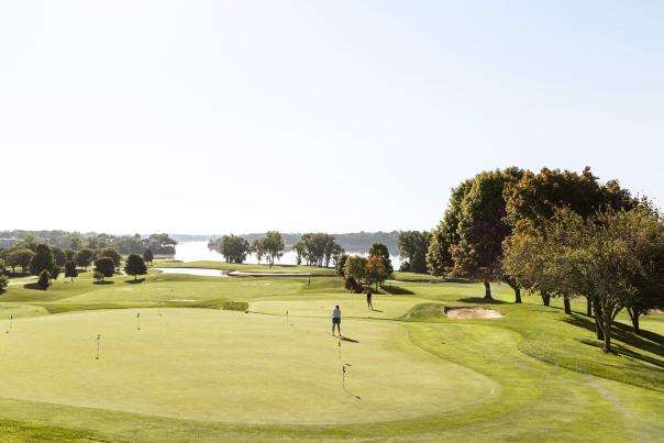 Two women putt on golfing greens at Eagle Crest Golf Club