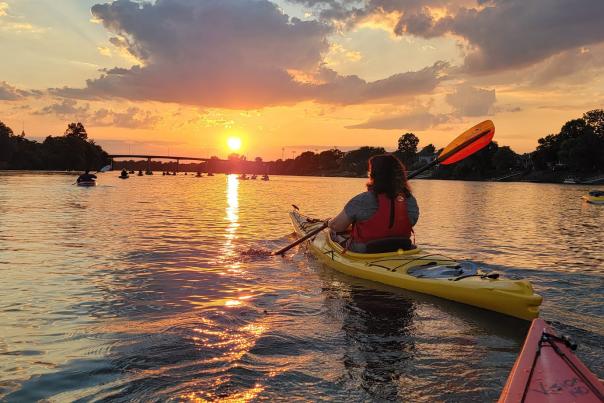 People Kayaking At Sunset On The Savannah River