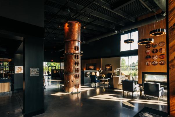 a metal still in hotel lobby, bourbon themed hotel
