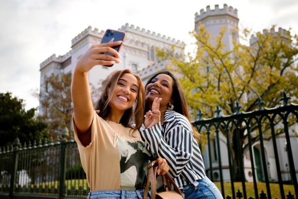 Women taking selfie in front of Old State Capitol