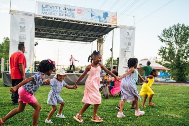 children playing at Levitt AMP music festival