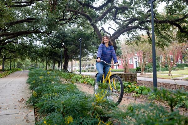 woman biking in downtown Baton Rouge