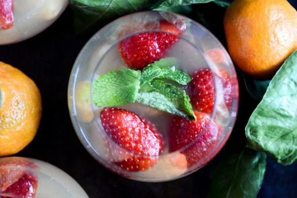 Holiday cocktail with strawberries & satsuma oranges