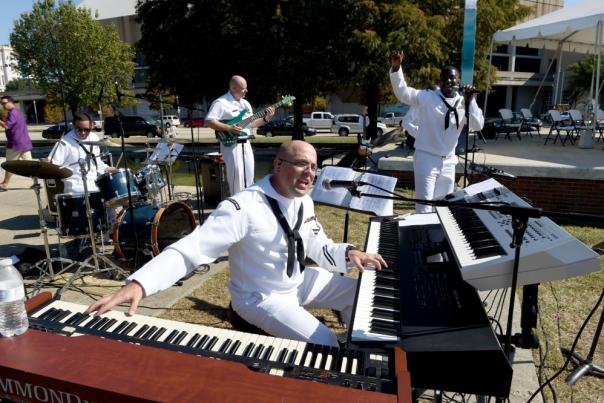 Members of the United States Fleet Forces rock band, Four Star Edition, preform a concert during a kickoff ceremony for Baton Rouge Navy Week.