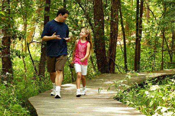 Father and Daughter on Trail Hike in Southeast Texas
