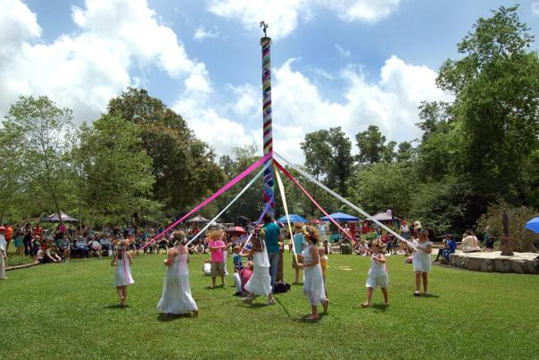 Children with ribbons dancing at the Beaumont Maypole Festival
