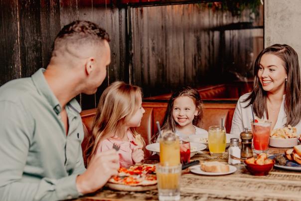 Family enjoying food at Coppi Restaurant.