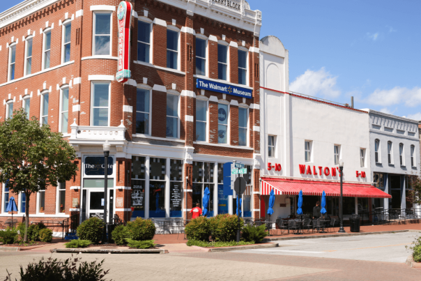 The Walmart Museum in Bentonville, featuring a classic red-brick building with "The Walmart Museum" sign.