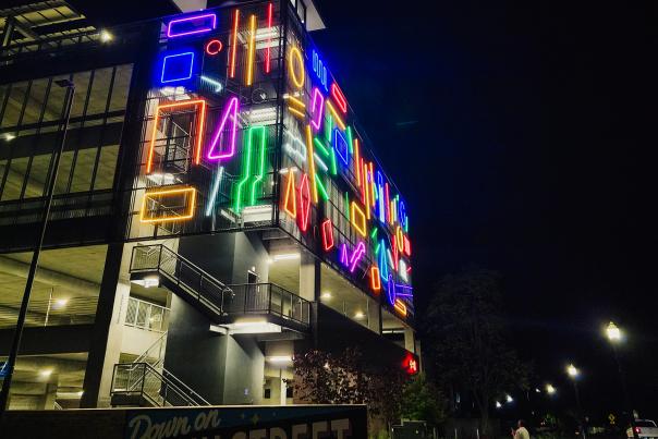 “Interactive Neon Mural #16,” by internationally recognized artist Spidertag, curated by Justkids, and courtesy of OZ Art NWA