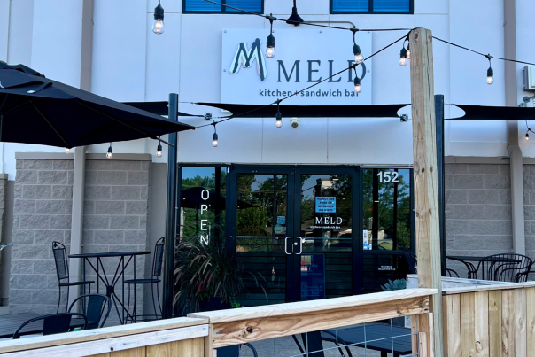 Exterior view of MELD, one of the best new restaurants in Bentonville, AR, featuring modern design and welcoming outdoor seating.