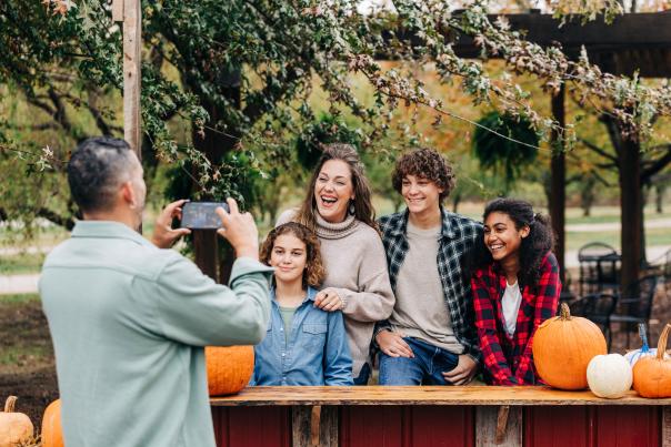 A family posing for a fall photo
