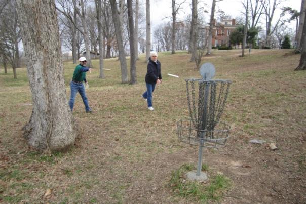 Disc Golf players on wooded course in Bowling Green