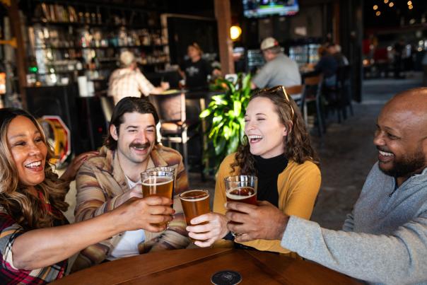 Friends enjoying a beer at White Squirrel Brewery
