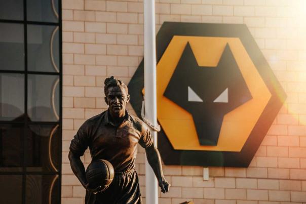 Footballer statue in front of Molineux football stadium