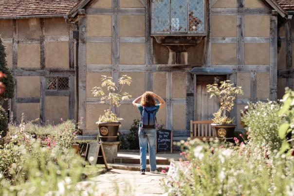 Woman looking up at Shakespeare's Birthplace