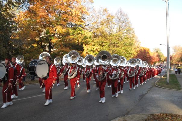 Marching band in uniform and playing their instruments at the IU Homecoming Parade