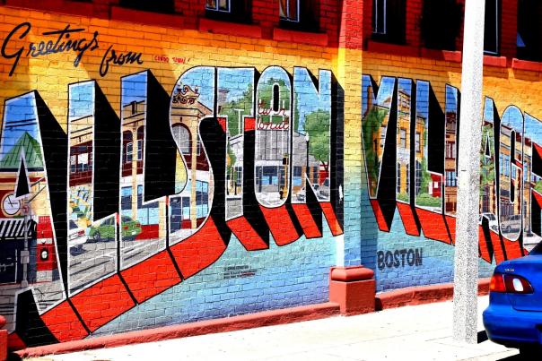 Mural of a postcard reading Greetings from Allston Village