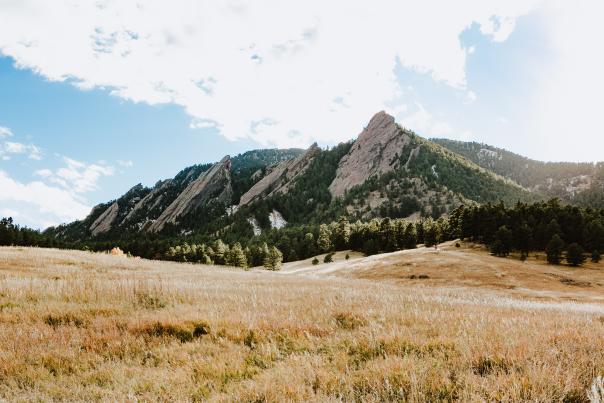 The Flatirons at Chautauqua with brown grass in the foreground