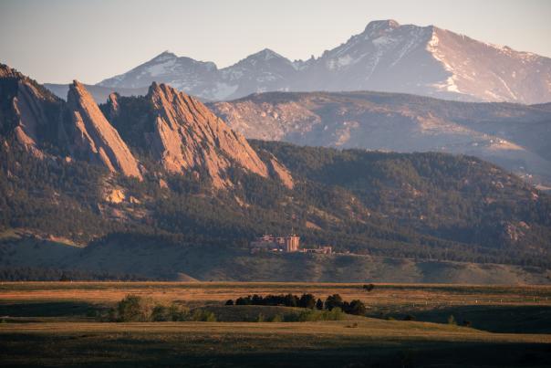 Boulder, Colorado's Flatirons with Wild Basin of Rocky Mountain National Park in the background. The view on your way into Boulder.