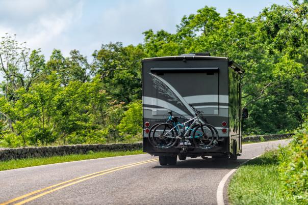 Luray, USA - June 1, 2019: View of road with rv trailer leading to forest in Shenandoah Blue Ridge appalachian mountains on skyline drive