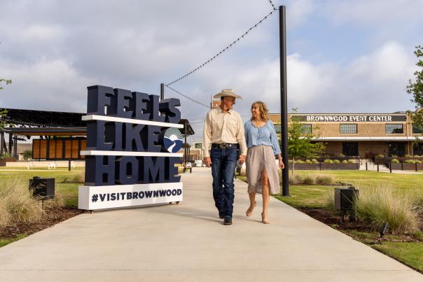 A couple walking at the Brownwood Event Center