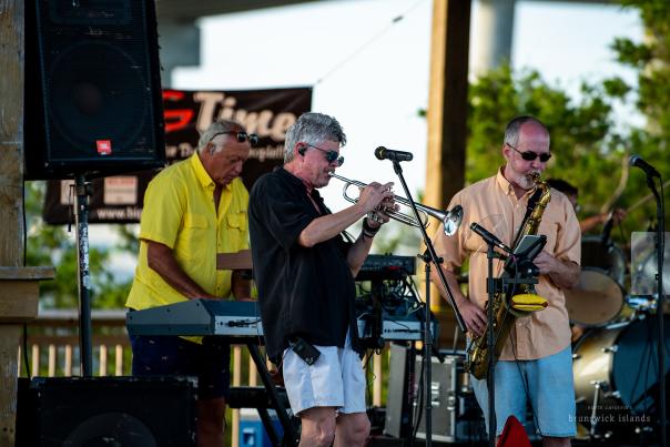 a band playing instruments on stage