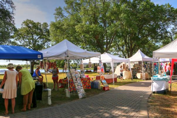 an outdoor farmers market at sunset beach town park