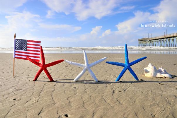small american flag with red white and blue starfish on a beach