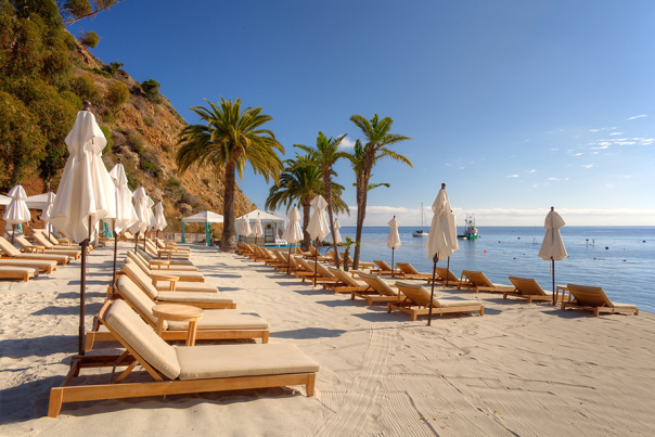 Chaises and umbrellas on the beach at Descanso Beach Club on Catalina Island