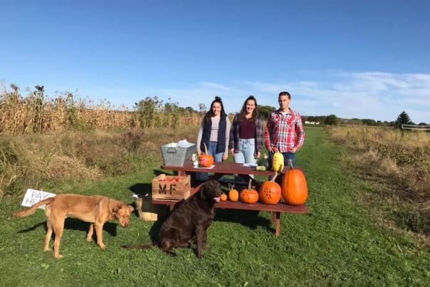 Morgan family with pumpking and pups