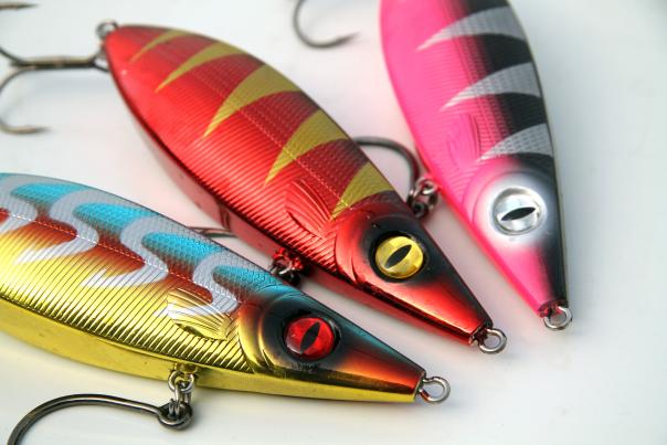 Three artifical brightly colored fighing lures