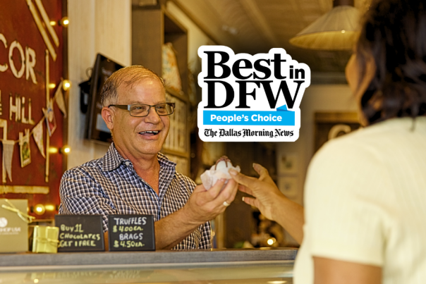 Photo of merchant giving truffle to customer with Best of DFW logo overlaid in center.