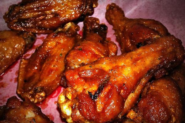 Close-up of chicken wings with sauce from ATL Wings in Chandler, AZ