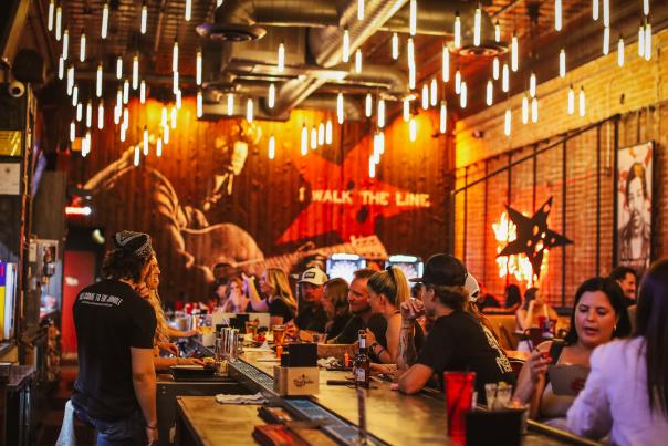nightlife scene at restaurant bar with lights and drinks