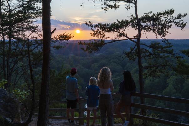 Family at Occoneechee Mountain Overlook at Sunset