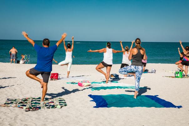Yoga on Englewood Beach at Chadwick Park by Loving Light Yoga in Englewood on a warm spring day.