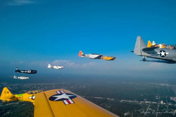 View of vintage airplanes flying formation from one of the formation airplanes