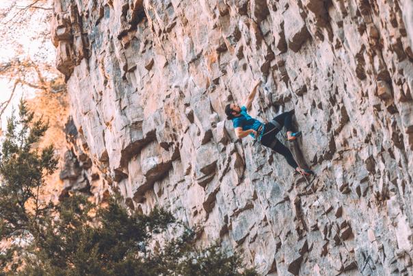 man climbs at Denny Cove