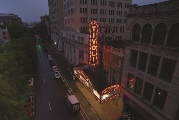 Aerial of Tivoli sign lit up in late evening