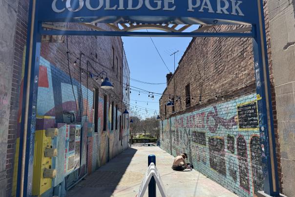 Coolidge park sign over chalk filled alley way.