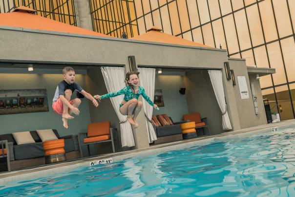 kids jump into the pool at the Westin