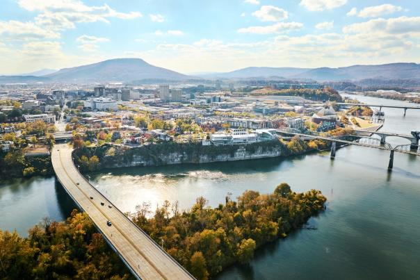 aerial image of river, maclellan island, and downtown