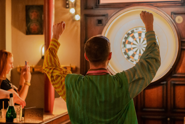 People playing a game of social darts at Flight Club