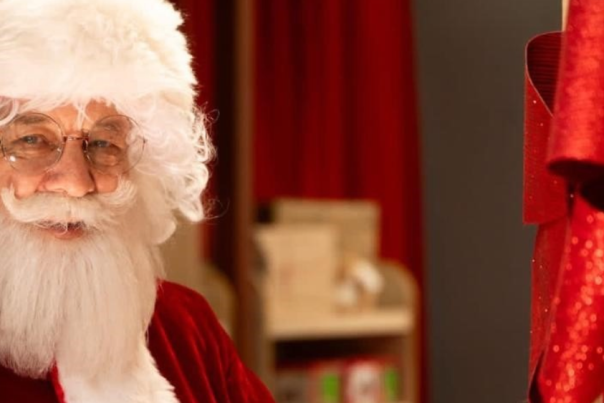 Santa opening a door