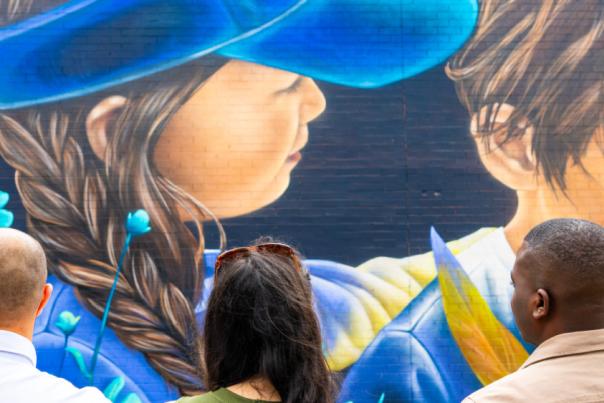 Visitors admiring the Cheltenham Paint Festival artwork.
