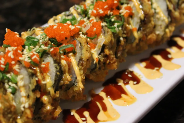 Delicious selection of Bajo Sushi presented on a wooden platter at a dining venue in Cheyenne, WY, ready to be enjoyed.