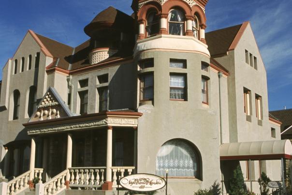The Nagle-Warren Mansion is a Victorian sandstone building with a beautiful turret and balcony.