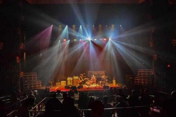 Live music performance with colorful lights at The Lincoln Cheyenne, a great rainy-day indoor attraction for adults.
